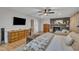 Comfortable bedroom with fireplace, hardwood floors, and neutral decor at 1003 W Divine St, Dunn, NC 28334