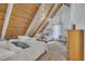 Bright bedroom with wood ceilings featuring two beds and ample natural light at 1003 W Divine St, Dunn, NC 28334