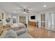 Bright bedroom with hardwood floors, natural lighting, and neutral decor at 1003 W Divine St, Dunn, NC 28334