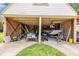 Spacious carport holds lawn care equipment and a Tracker fishing boat at 1003 W Divine St, Dunn, NC 28334