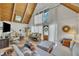 Bright living room featuring vaulted ceilings, wood floors, and stylish furnishings at 1003 W Divine St, Dunn, NC 28334