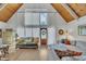 Open-concept living room with tall ceilings, wood floors, and a welcoming atmosphere at 1003 W Divine St, Dunn, NC 28334