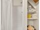 Shower with shelves featuring towels and accessories at 1003 W Divine St, Dunn, NC 28334