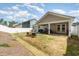 Expansive backyard features a covered patio, some grass, and a white vinyl fence at 1012 Ringhill Bluff Dr, Durham, NC 27704