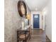 Inviting hallway with modern decor, stylish console table, and a glimpse of the front door at 1012 Ringhill Bluff Dr, Durham, NC 27704