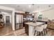 Open kitchen featuring stainless steel appliances, granite countertops, an island, and bar stool seating at 1012 Ringhill Bluff Dr, Durham, NC 27704