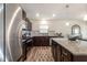 Bright kitchen featuring stainless steel appliances, granite countertops, an island, and wood-look flooring at 1012 Ringhill Bluff Dr, Durham, NC 27704