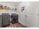 Functional laundry room featuring a washer, dryer, and ample storage space at 1012 Ringhill Bluff Dr, Durham, NC 27704