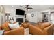 Open concept living room with leather seating, fireplace, and access to other rooms at 1012 Ringhill Bluff Dr, Durham, NC 27704