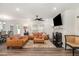 Inviting living room with leather furniture, a fireplace, and natural light from the window at 1012 Ringhill Bluff Dr, Durham, NC 27704