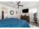 Spacious main bedroom featuring a TV, modern ceiling fan, a ceiling fan, and ample space at 1012 Ringhill Bluff Dr, Durham, NC 27704