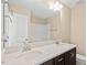Bright bathroom featuring a double vanity with white countertop and modern fixtures at 1027 Myers Point Dr, Morrisville, NC 27560