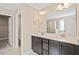 Bathroom with double vanity, large mirror, and adjacent room with shower and toilet at 1027 Myers Point Dr, Morrisville, NC 27560