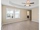 Bedroom with large windows allowing ample natural light with neutral walls and modern flooring at 1027 Myers Point Dr, Morrisville, NC 27560