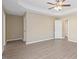 Spacious main bedroom with neutral walls, tray ceiling, ceiling fan, and plenty of natural light at 1027 Myers Point Dr, Morrisville, NC 27560