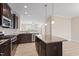 Modern kitchen with stainless steel appliances, granite countertops, and kitchen island at 1027 Myers Point Dr, Morrisville, NC 27560