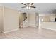 Open-concept space with hardwood floors, staircase, and a partial view of kitchen at 1027 Myers Point Dr, Morrisville, NC 27560