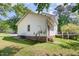 Exterior view of home featuring a large backyard and deck area at 105 Hiddenwood Ct, Garner, NC 27529