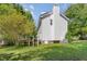 Exterior of the home, features a deck and yard shaded by a large tree at 105 Hiddenwood Ct, Garner, NC 27529