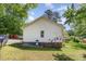 Exterior view of home featuring a small backyard and deck area at 105 Hiddenwood Ct, Garner, NC 27529