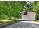 Charming two-story home with a two-car garage and lush greenery in a well-maintained neighborhood at 105 Hiddenwood Ct, Garner, NC 27529