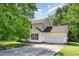 Charming two-story home with a two-car garage and lush greenery in a well-maintained neighborhood at 105 Hiddenwood Ct, Garner, NC 27529