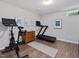 Finished basement gym complete with stationary bike, treadmill and workout mat at 105 Highlands Lake Dr, Cary, NC 27518