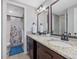 Bathroom featuring double vanity, granite countertops, and tiled floors at 105 Highlands Lake Dr, Cary, NC 27518