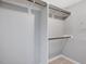 Empty closet with shelves and rods for optimal storage at 105 Highlands Lake Dr, Cary, NC 27518