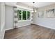 Bright dining room with large windows and stylish light fixture at 105 Highlands Lake Dr, Cary, NC 27518