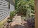 Beautifully landscaped walkway with stone steps and accent lighting, enhancing the outdoor space at 105 Highlands Lake Dr, Cary, NC 27518