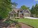 Beautiful two-story home with manicured landscaping and a convenient two-car garage at 105 Highlands Lake Dr, Cary, NC 27518