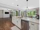 Spacious kitchen island with granite countertop and stainless steel dishwasher at 105 Highlands Lake Dr, Cary, NC 27518