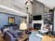Stunning living room with soaring ceilings, stone fireplace, and ample natural light at 105 Highlands Lake Dr, Cary, NC 27518
