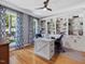 Well-lit home office with built-in bookcases and large windows, perfect for productivity at 105 Highlands Lake Dr, Cary, NC 27518
