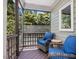 Relaxing screened porch with comfortable seating, providing a serene outdoor retreat at 105 Highlands Lake Dr, Cary, NC 27518