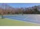 Well maintained tennis court with lighting and fresh nets, ready for a game at 105 Highlands Lake Dr, Cary, NC 27518