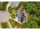 Aerial view of the house featuring a deck, solar panels and a landscaped yard at 108 Nimbus Ct, Cary, NC 27513