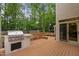 An outdoor kitchen and grill area are attached to the large back deck with seating at 108 Nimbus Ct, Cary, NC 27513