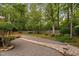 Landscaped backyard with gravel pathway and lush greenery providing a serene and private outdoor space at 108 Nimbus Ct, Cary, NC 27513