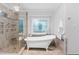 Bright bathroom featuring a clawfoot tub with decorative tile accent, a glass enclosed shower, and a stained glass window at 108 Nimbus Ct, Cary, NC 27513