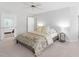 Spacious bedroom featuring soft, neutral tones, large windows, and an ensuite bathroom with a soaking tub at 108 Nimbus Ct, Cary, NC 27513
