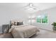 Bedroom with neutral colors, bright windows and a ceiling fan at 108 Nimbus Ct, Cary, NC 27513