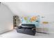 Bonus room featuring a leather sofa, shelving, and a map of the world at 108 Nimbus Ct, Cary, NC 27513
