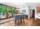 Bright breakfast nook boasts backyard views through expansive windows, with convenient beverage center at 108 Nimbus Ct, Cary, NC 27513