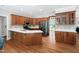 Spacious kitchen features custom wood cabinetry, stainless steel appliances, and an eat-in island at 108 Nimbus Ct, Cary, NC 27513