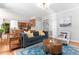 Living room view showcasing access to kitchen and hardwood flooring at 108 Nimbus Ct, Cary, NC 27513