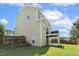 Inviting backyard featuring a spacious lawn, wooden fence and an elevated deck, perfect for entertaining at 109 Lyngrove St, Holly Springs, NC 27540