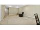 Spacious basement with neutral walls, carpet, and plenty of room for relaxing or entertaining guests at 109 Lyngrove St, Holly Springs, NC 27540