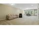 Spacious basement with neutral walls, carpet, and plenty of room for relaxing or entertaining guests at 109 Lyngrove St, Holly Springs, NC 27540